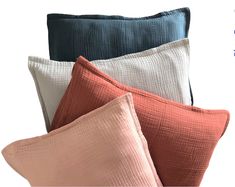 four pillows with different colors on them and the text, pillow cases made from linens