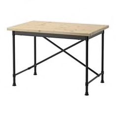 the table is made out of metal and has a wooden top with black steel legs