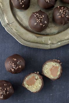 chocolate truffles are arranged on a platter