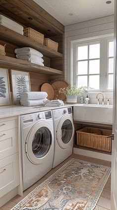 a washer and dryer sitting in a bathroom next to each other on top of a rug