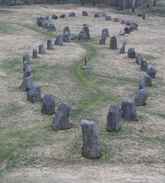 a circle made out of rocks in the middle of a field