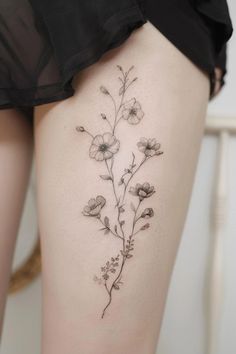 a woman's thigh with flowers on it