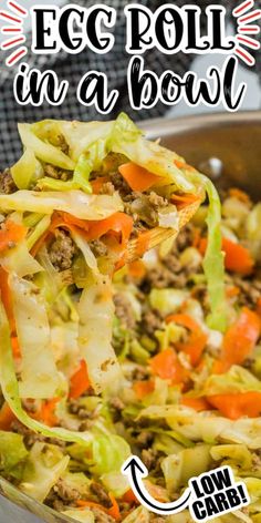 an egg roll in a bowl with carrots and lettuce being lifted from it