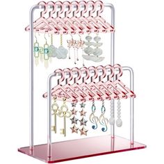 a rack with several pairs of earrings hanging from it