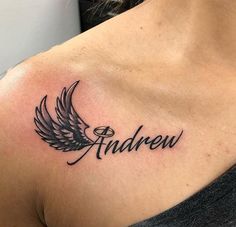 a woman's chest with an angel wing tattoo on her left shoulder and the word andrew written in cursive font