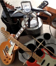 guitars and other musical instruments on the floor