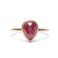 A conflict-free pear-shaped rose cut ruby set in a narrow 14k yellow gold band with a matte finish. The Pirum Ring is designed by Betsy & Iya and handcrafted in Portland Commitment Rings, Natural Ruby Ring, Ring Birthstone, Gift Ring, Ruby Ring, Natural Ruby, Perfect Ring, Birthstone Ring, Ring Handmade