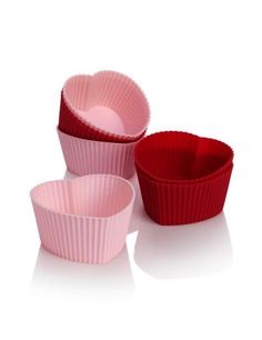 three red and pink cupcake cases sitting next to each other