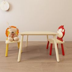 two children's chairs and a table with a stuffed animal on the back one