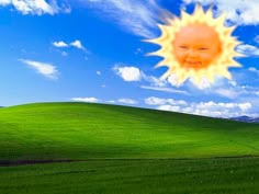 an image of a sun in the sky over a green field