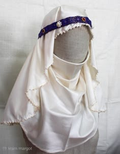 The offer includes: 1. A round silk head-veil with pearls. 2. White silk wimple. 3. Silk fillet with pearls. Silk headdresses (kerchief, wimple and fillet) with natural pearls for a medieval noblewoman. A kerchief is a hand hemmed oval-shaped silk scarf with natural perls on the edges, held in place by strip of another silk fabric (fillet). The ornamental band is the basis for a smooth veil. A wimple is a medieval form of female headdress formed of a large piece of cloth worn around the neck and Medieval Veil Head Coverings, Medieval Historical Clothing, Medieval Veil, Medieval Headdress, 13th Century Clothing, Medieval Items, Medieval Lady, Medieval Hats, Silk Veil