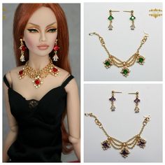 the doll is wearing three different necklaces and earring sets, including one with dangling earrings