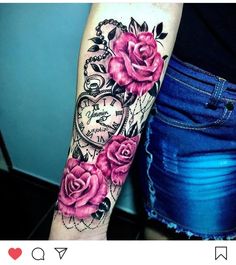 a woman's arm with pink roses and an old pocket watch tattoo on it