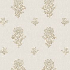 a white and gold wallpaper with flowers on the bottom half of it, as well as small dots in the middle