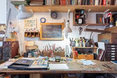 an old desk with lots of books on it