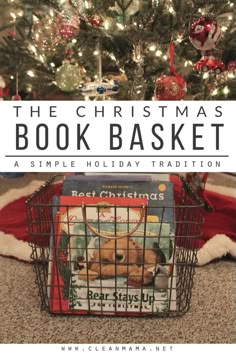 the christmas book basket is sitting in front of a christmas tree