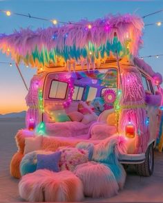 a vw bus decorated with feathers and lights