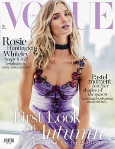 a woman in a purple dress on the cover of a magazine