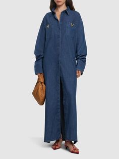 This VALENTINO long shirt dress is crafted from denim chambray. It features a collared neckline, long sleeves, a front button closure, a front metal logo details, two breast patch pockets, and a relaxed fit. V Logo, Valentino Women, Dress Tunic, Long Shirt Dress, Chambray Shirt, Metal Logo, Long Shirt, Metallic Logo, Tunic Dress