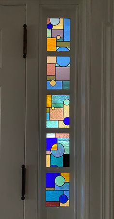 a stained glass window on the front door