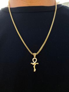 Type: 14K Yellow Gold Pendant Finish: Polished Pendant Width: 15 mm Pendant Length: 37 mm Average Weight: 3.12 gr . . #crosspendant #crosscharm #goldcross #crossnecklace #goldpendant #goldnecklace #pendant #fashion #giftfordad #mothersdaygift #weddinggift #birthdaygiftsforboyfriend Anniversary Curb Chain Pendant Jewelry, Anniversary Pendant Jewelry With Curb Chain, Anniversary Pendant With Curb Chain, Symbolic Gold Necklaces For Formal Occasions, Symbolic Gold Necklaces For Formal Events, 14k Gold Jewelry With Curb Chain, Symbolic Yellow Gold Jewelry With Box Chain, Fine Gold Jewelry With Curb Chain, Gold Ankh Jewelry For Anniversary