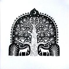 an intricately designed tree with two deers under it