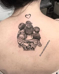 the back of a woman's neck with an image of two children on it