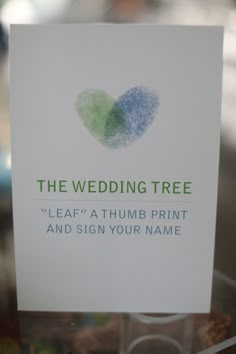 a card with a heart on it that says the wedding tree leaf at thumb print and sign your name