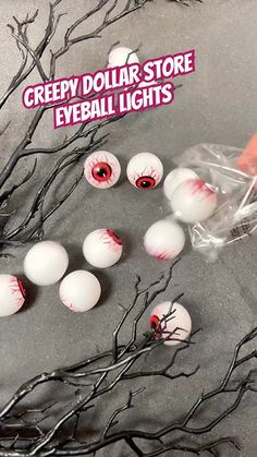 creepy dollar store eyeball lights are being used to decorate the tree branches with fake eyes