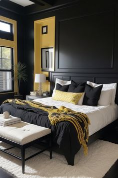 a black and white bedroom with yellow accents