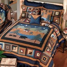 a bed covered in a blue and brown quilt