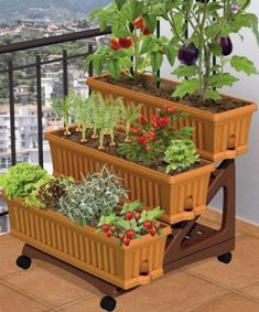 three planters are stacked on top of each other with plants growing out of them