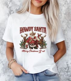 Howdy Santa Comfort Colors, Merry Christmas Yall Shirt, Western Christmas Shirt, Cowboy Christmas Shirt, Country Christmas, Christmas Crewneck How to Place an Order: Review Information: Carefully read all the provided details before placing your order. Select Item Type and Size: Choose the item type and size from the dropdown menu. Select Item Color: Pick the color of the item using the dropdown menu. Specify Design Color: In the optional message section, specify the design color (white or black). Add More Items: To add more items, first add the current item to your cart. Press the back button and repeat steps 1-4 for each additional item. Complete Your Order: When all desired items are in your cart, proceed to checkout. Enter your payment method and shipping address, then click submit to Christmas Cow T Shirt, Western Christmas Shirts, Merry Christmas Yall, Santa Sweatshirt, Cowboy Christmas, Christmas Crewneck, Santa Shirts, Western Christmas, Cow Boy