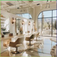 a hair salon with chairs and mirrors in front of large windows that overlook the mountains