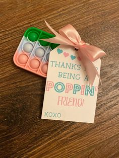 there is a card that says thanks being a poppin friend next to some candy