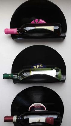 two black records with wine bottles on them