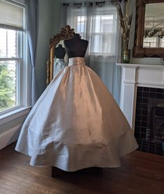 "This is a beautiful full skirt that can be made from satin, taffeta, or lame. Perfect for any costume it has a 4 inch tall waistband we make to your measurement and laces up the back giving you a great fit. The tall waistband helps to keep the skirt in place under your bodice or corset, not allowing it to twist or shift through the day. These are very full with plenty of room for a hoop skirt or a crinoline or both. Averaging 150\" wide at the bottom and hemmed to your length. This is great for Flower Sprite, Victorian Skirt, White Costumes, Hoop Skirt, Princess Costume, Butterfly Dress, Beautiful Costumes, Find Color, Happily Married