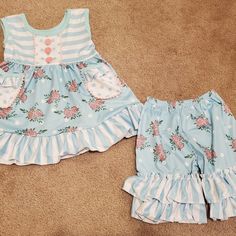 New In Package. Blue Floral Ruffle Shorts Outfit. Runs Generous To Size Marked. Top Has Pockets.. Sizes Available: 6-12 Month, 12-18 Month, 2t, 3t, 5-6, 6-7. 95% Cotton, 5% Spandex. Soft Material. Cute Ruffled Bottoms For Playwear, Cute Blue Summer Bloomers, Blue Ruffled Bloomers For Summer, Casual Blue Bloomers For Spring, Blue Cotton Bloomers With Ruffles, Summer Blue Ruffled Bloomers, Spring Blue Cotton Bloomers, Playful Blue Ruffled Bottoms, Cute Ruffled Bottoms For Playtime