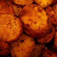 close up view of cooked potatoes with oil on them