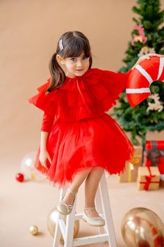 Add a touch of magic to your little one's wardrobe with our enchanting Red Tutu Dress Set. Designed for birthdays, Halloween, or special occasions, this beautiful tutu dress with a matching cape combines comfort and elegance, ensuring your child feels like a fairy-tale princess. What's Included: This set features a tulle tutu skirt, a flowing cape, and a matching cotton-lined tutu dress. Made from soft, breathable cotton, this set is perfect for all-day comfort and play. The tulle skirt is paire Red Tutu Dress, Tutu En Tulle, Red Tutu, Tulle Tutu Skirt, Christmas Costumes, Cape Dress, Girls Clothing Sets, Tutu Skirt, Costume Halloween