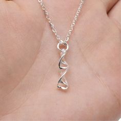 (1)Metal Material: sterling silver (2)DNA Size: length 20mm, width 4.5mm, ring hole 3.5mm (3)Clasp Type: lobster clasp (4)Link Size: width 1.6mm (5)Chain Length: 16, 18, 20, 22, 24, 26 inches (6)Package: in a bubble emailer For more necklaces, please find here: https://www.etsy.com/shop/LBCreatives?ref=seller-platform-mcnav&section_id=24284749 We offer free standard shipping for all orders. Also, we provide 10% off for orders more than $250. You don't need to apply any coupon. The system will ca Dna Necklace, Swirl Necklace, Spiral Necklace, Double Helix, Helix, Cable Chain, Chain Lengths, Charm Necklace, Swirl