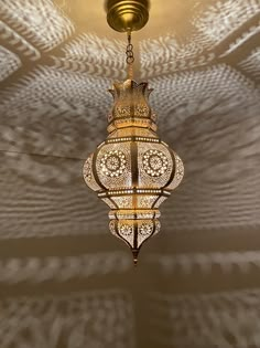 a chandelier hanging from the ceiling in a room