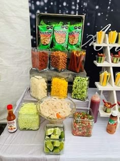 a table topped with lots of food and condiments