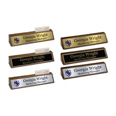 four business name tags are placed on top of each other in front of a white background