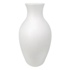 a white vase sitting on top of a table