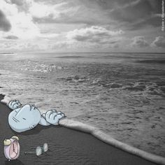 a cartoon character laying on top of a beach next to the ocean