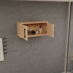 an open cabinet on the wall in a bathroom