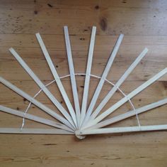 a group of wooden sticks sitting on top of a wooden floor next to each other