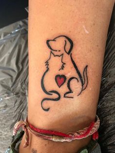 a dog with a heart tattoo on its leg