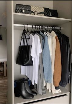 an organized closet with clothes and handbags